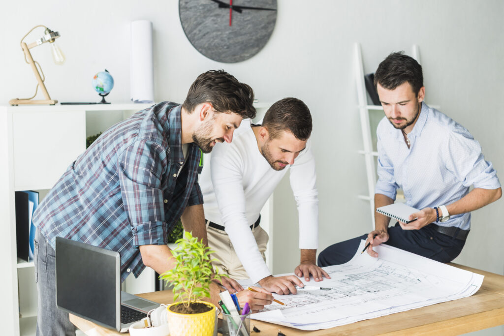 group-male-architect-preparing-blueprint-office